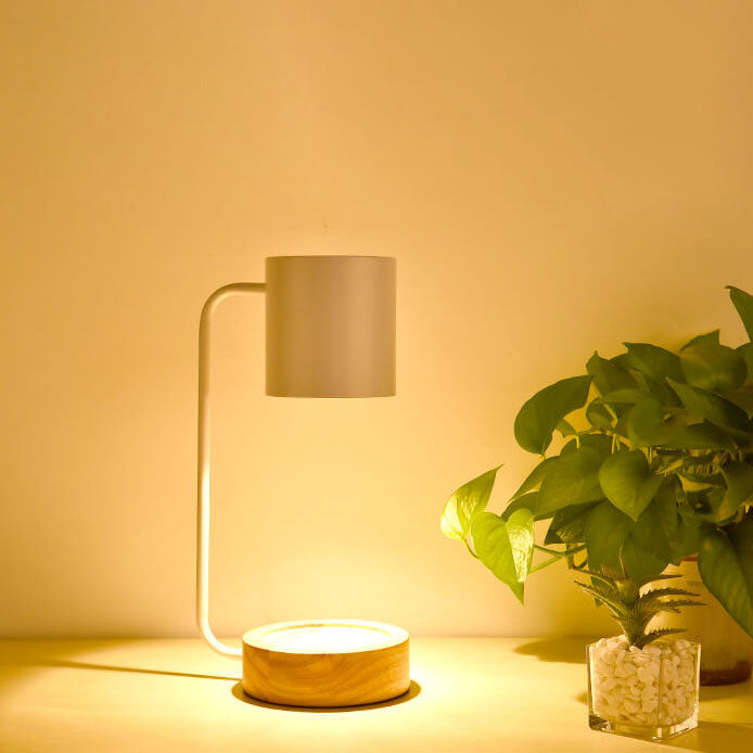 Melting wax table lamp with wooden base, detail view