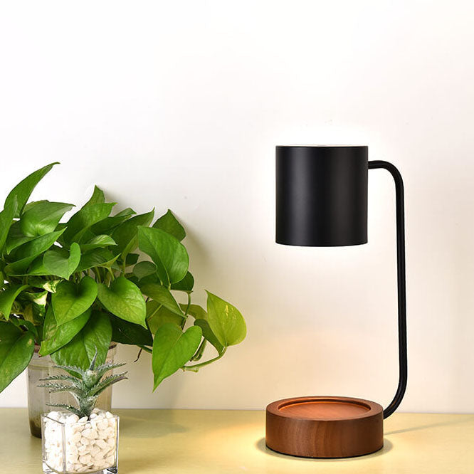 Melting wax table lamp with wooden base, detail view