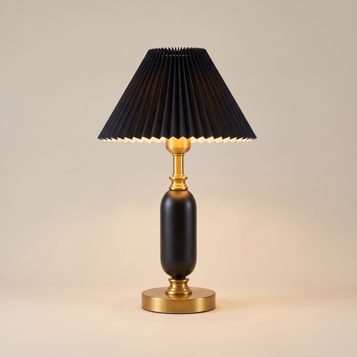 French pleated shade table lamp, lit, on a warm neutral background